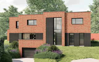 Façade avant d'une maison contemporaine cubique en briques actuellement en construction dans le Nord